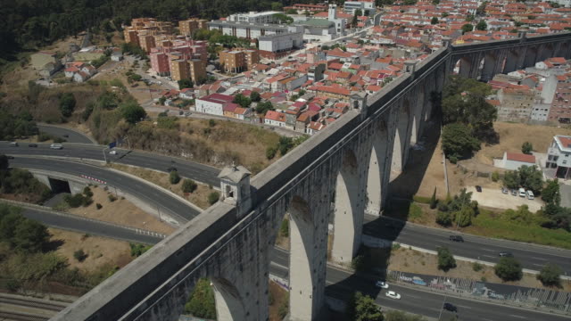 portugal-sunny-day-lisbon-aqueduct-of-the-free-waters-traffic-road-aerial-panorama-4k