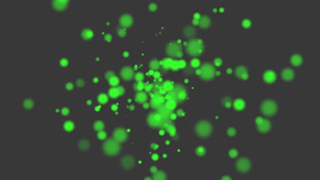 Fliegen-Und-Fallende-Grüne-Runde-Partikel-Mit-Glitzern-Auf-Schwarzem-Farbverlauf
