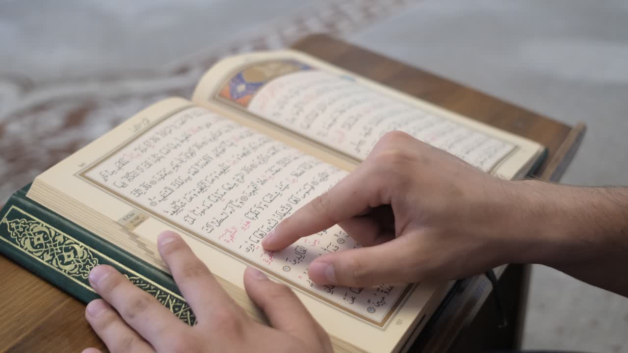 Premium stock video - Reading quran sentences