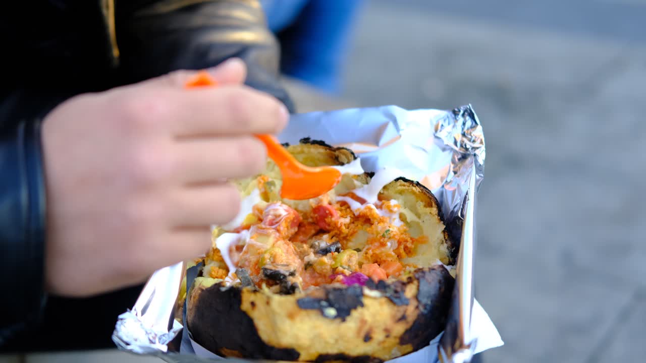 Premium Stock Video - Cuisine Baked Potato Street Food