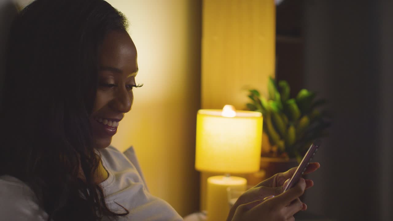 free-stock-video-close-up-of-couple-relaxing-at-home-at-night-in-bed