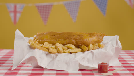 Studio-Shot-Of-Traditional-British-Takeaway-Meal-Of-Fish-And-Chips-1