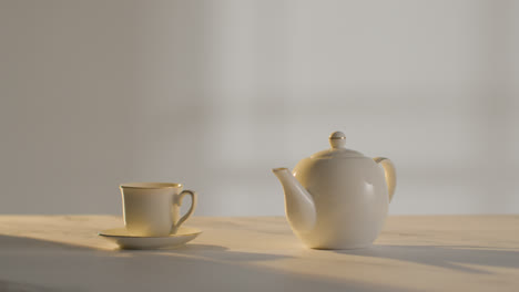 Studio-Shot-Of-Making-Traditional-British-Cup-Of-Tea-Using-Teapot-1