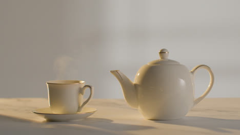 Studio-Shot-Of-Making-Traditional-British-Cup-Of-Tea-Using-Teapot-2