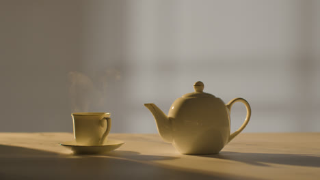 Studio-Shot-Of-Making-Traditional-British-Cup-Of-Tea-Using-Teapot-5