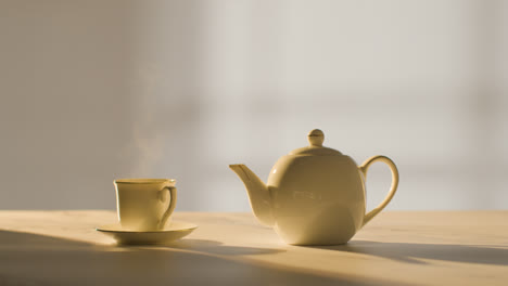 Studio-Shot-Of-Making-Traditional-British-Cup-Of-Tea-Using-Teapot-6