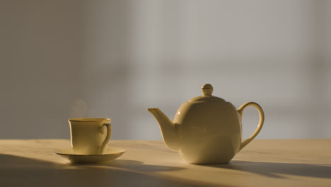 Studio-Shot-Of-Making-Traditional-British-Cup-Of-Tea-Using-Teapot-7
