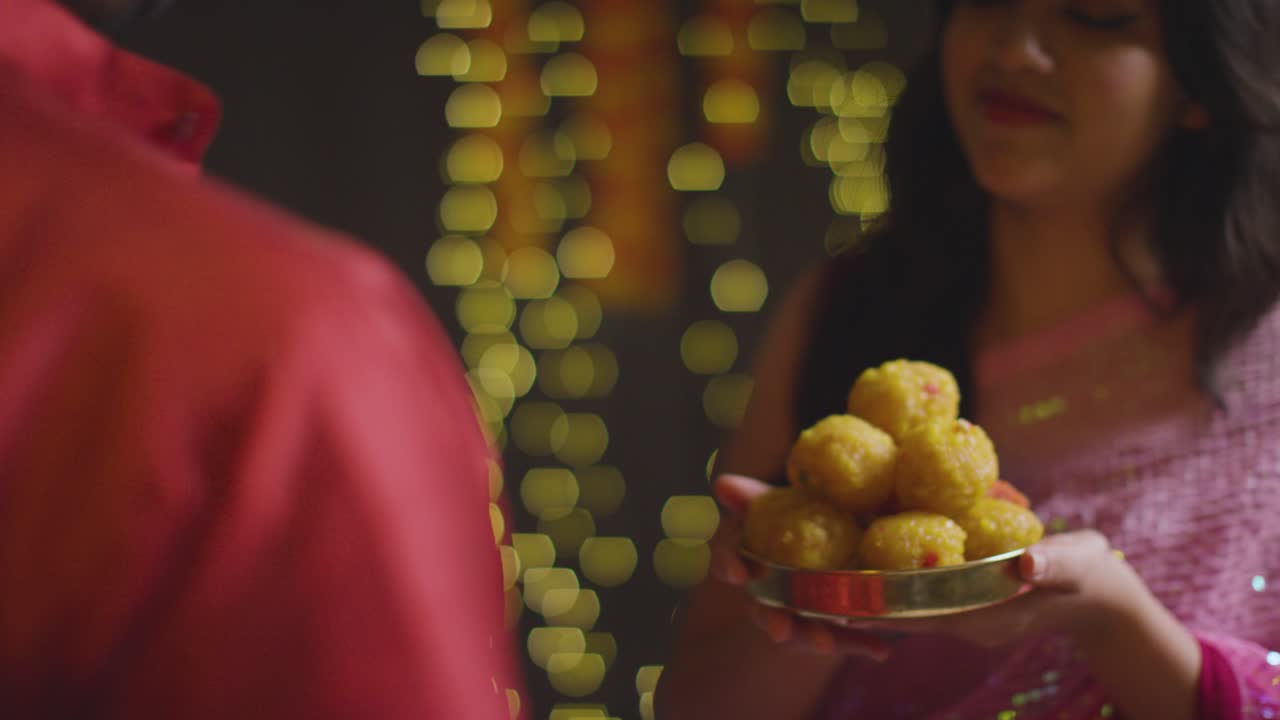 Free Stock Video - Close Up Of Woman Giving Ladoo To Man To Eat 