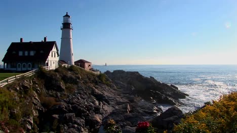 The-Portland-Head-Lighthouse-oversees-the-ocean-from-rocks-in-Maine-New-England--3