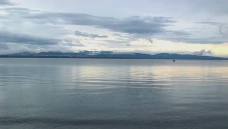 Smooth-water-ripples-under-a-grey-sky-at-Lake-Champlain-in-Vermont