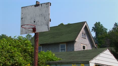 An-old-basketball-hoop-near-a-house