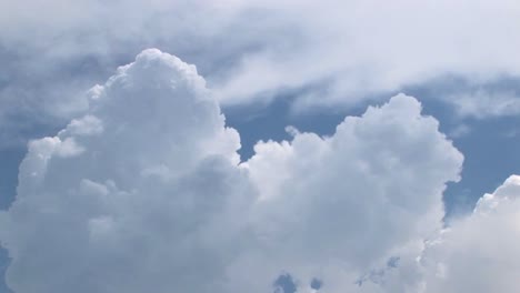 A-time-lapse-of-thunderclouds-expanding-in-a-blue-sky-2