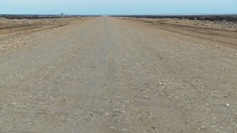 Pan-across-a-perspective-down-a-lonely-abandoned-road