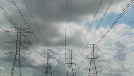 Time-lapse-of-clouds-moving-behind-high-tension-wires-and-power-lines-2