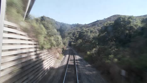 Exciting-POV-shot-point-of-view-of-a-train-down-tracks-and-into-a-tunnel