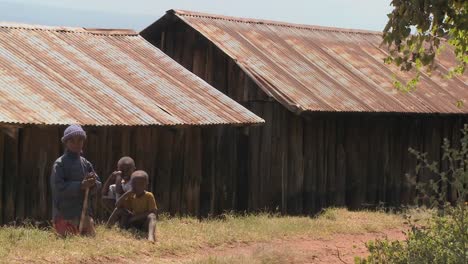 African-children-sit-near-a-slum