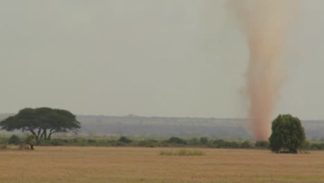 A-dust-devil-dust-tornado-blows-across-the-plains-of-Africa