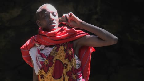 A-Masai-man-in-tribal-costume-talks-on-a-cell-phone
