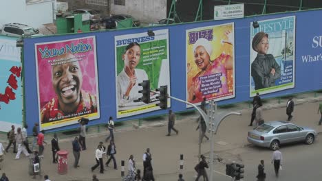 Handprinted-billboard-signs-along-a-busy-street-in-kenya