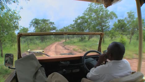 Point-of-view-of-a-driver-driving-on-a-dirt-road-in-Africa