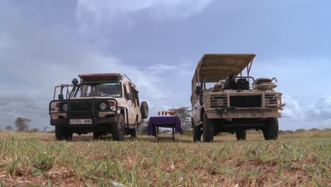 Safari-jeeps-are-parked-on-the-plains-of-Africa