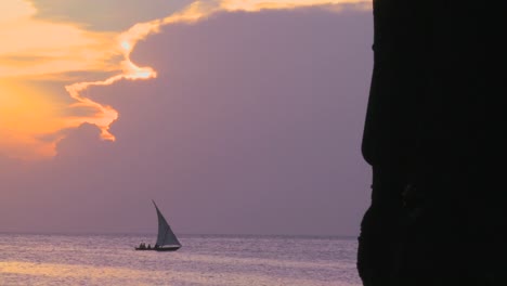A-sailboat-silhouetted-against-a-beautiful-sunset-in-Zanzibar