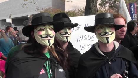 Three-masked-men-posing-at-the-Jon-Stewart-rally-in-Washington-DC
