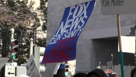 A-sign-at-a-rally-says-Fox-News-For-Sanity-Just-Kidding