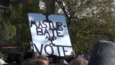 A-sign-at-a-rally-says-I-Masturbate-and-I-Vote
