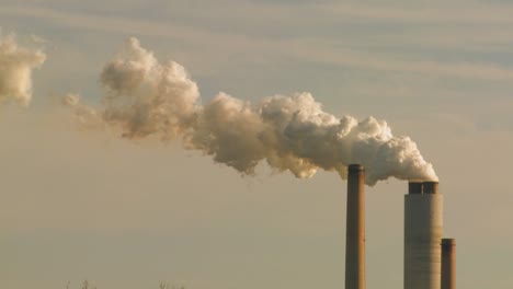 A-power-plant-with-smokestacks-belches-smoke-into-the-air-1