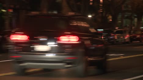 A-police-car-drives-on-a-downtown-Los-Angeles-street-at-night