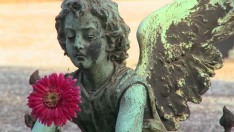 An-angel-sculpture-in-a-cemetery-on-a-grave