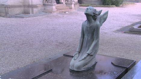 An-angel-sculpture-in-a-cemetery-on-a-grave-4
