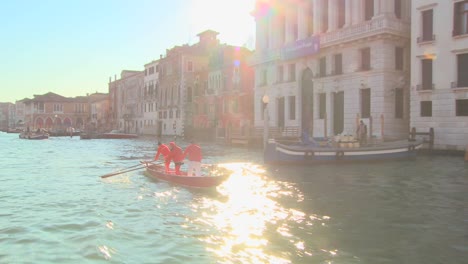 A-gondola-is-rowed-along-the-Grand-Canal-in-Venice-Italy