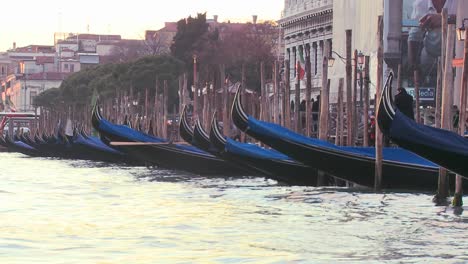 Gondolas-bob-in-the-waves-along-a-canal-in-Venice-Italy
