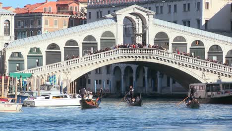 Gondolas-under-the-Rialto-Bridge-in-Venice-Italy