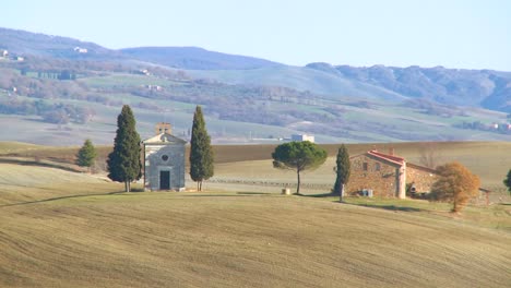 A-beautiful-farmhouse-and-church-in-Tuscany-Italy