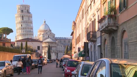A-street-in-Pisa-Italy-with-the-leaning-tower-in-background-1