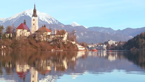 The-reflection-of-a-church-steeple-in-the-waters-of-Lake-Bled-Slovenia-1