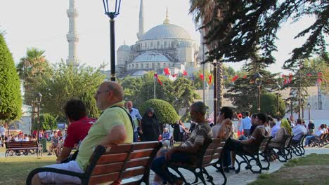 Pedestrians-walk-and-sit-on-benches-near-the-Blue-Mosque-in-istanbul-Turkey-1