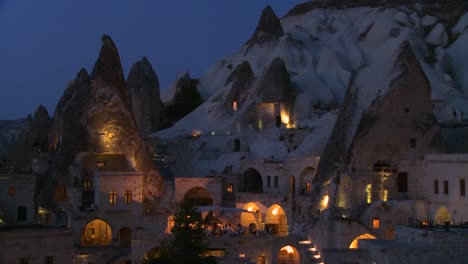 Strange-dwellings-built-into-a-hillside-at-dusk-or-night-in-Cappadocia-Turkey