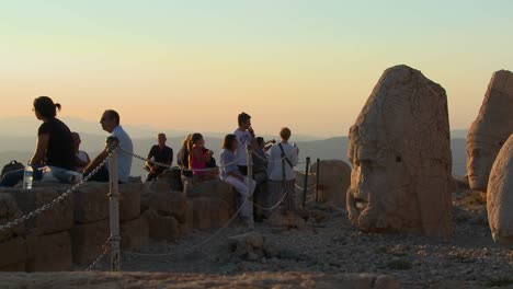 Tourists-take-photos-of-the-great-archeological-ruins-on-the-top-of-Mt-Nemrut-Turkey