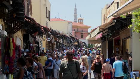 Tourists-walk-through-the-crowded-streets-of-Rhodes-Greece