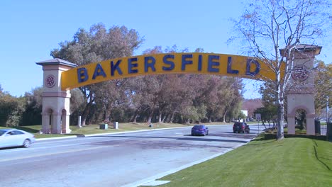 Cars-drive-into-Bakersfield-California-under-the-traditional-arched-gateway-to-the-city