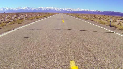 POV-shot-along-a-desert-road-driving-fast-1