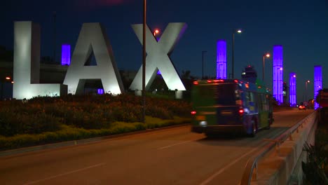 Cars-pass-by-the-LAX-sign-on-their-way-into-Los-Angeles-airport