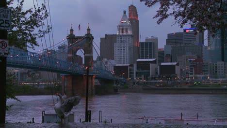 Nighttime-falls-over-Cincinnati-as-riverboats-pass-on-the-Ohio-River-3