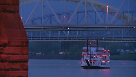 A-riverboat-passes-under-the-bridges-of-Cincinnati-on-the-Ohio-River-1