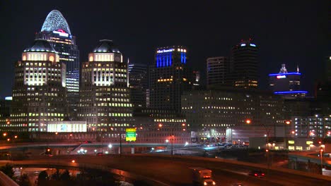An-establishing-shot-of-Cincinnati-Ohio-at-night-with-freeways-foreground-1