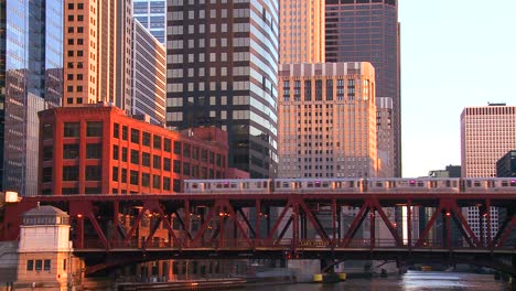 The-El-train-travels-over-a-bridge-in-front-of-the-Chicago-skyline-1